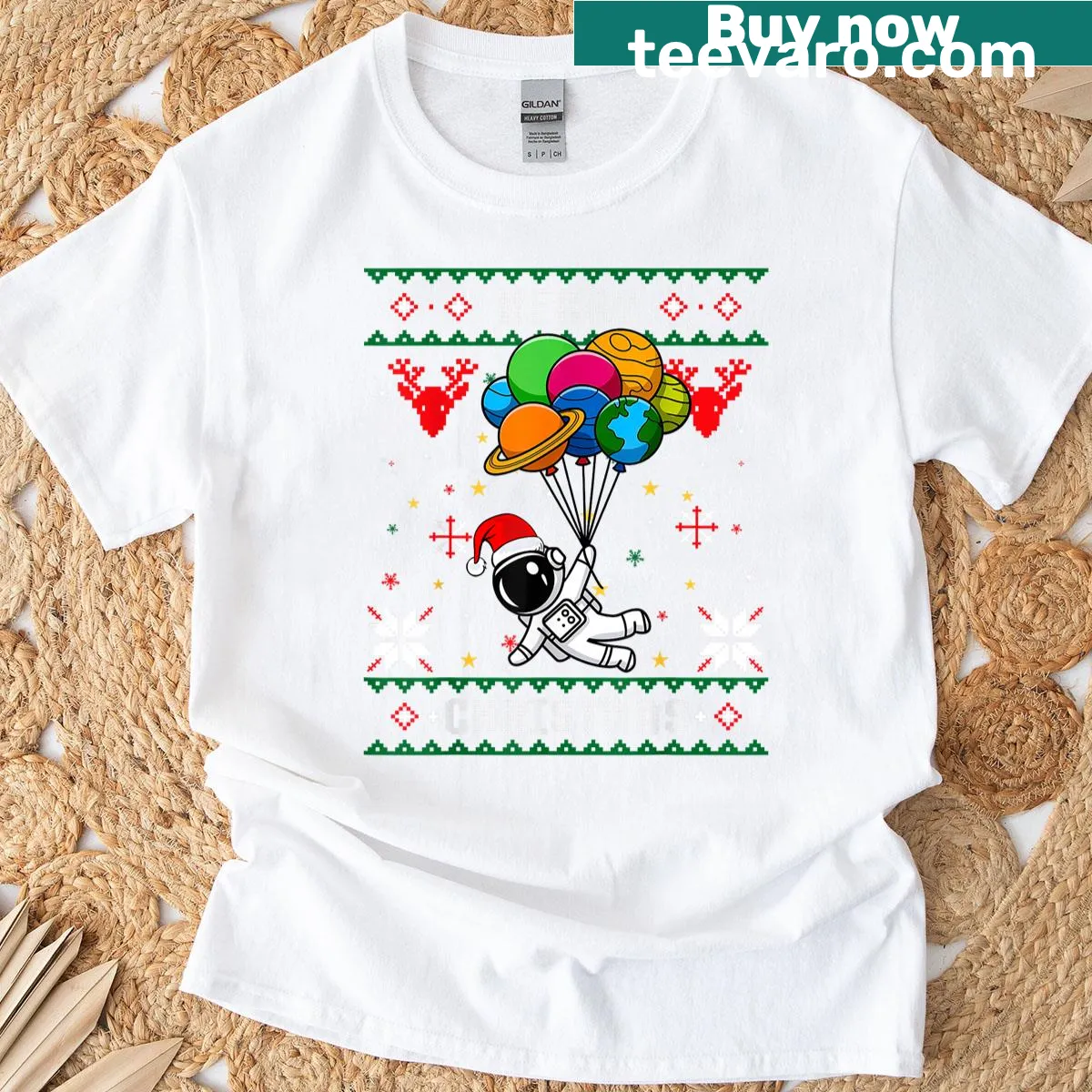 Cartoon astronaut in Santa hat holding a planet with Christmas tree — on a men's t-shirt