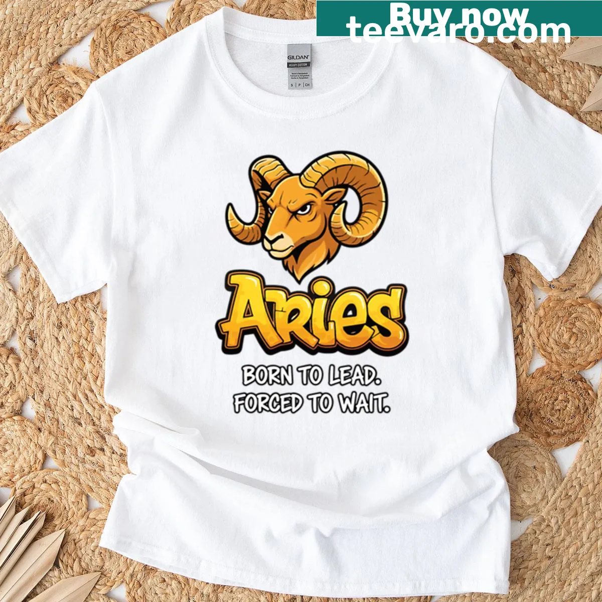 Bold typographic graphic stating 'Born To Lead Aries' on T-shirt — on a men's t-shirt
