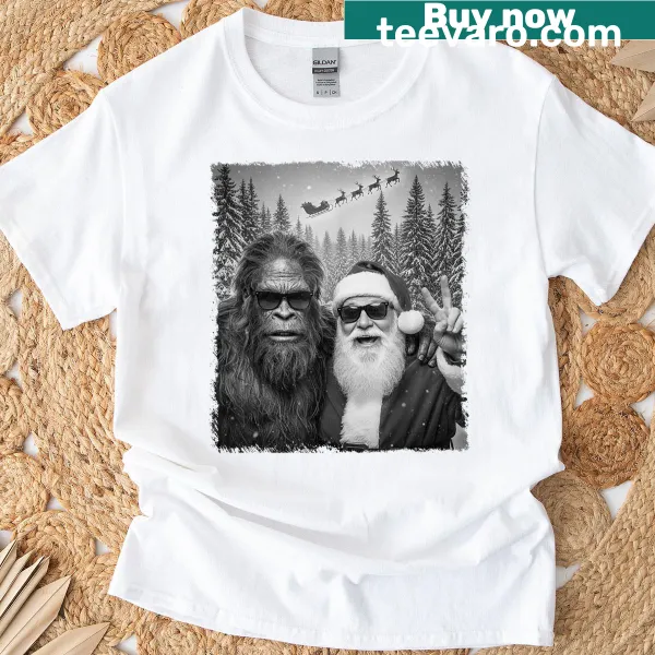 Funny Sasquatch taking a selfie with Santa graphic on t-shirt