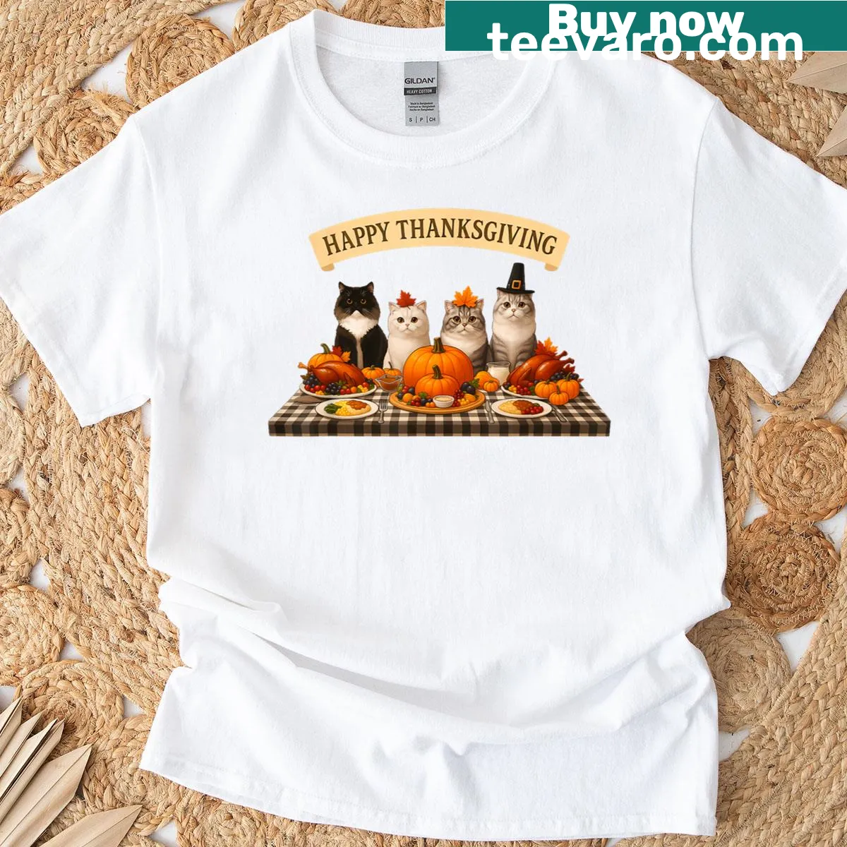 Thanksgiving T-shirt featuring cats at a dinner feast with autumn leaves. — on a men's t-shirt