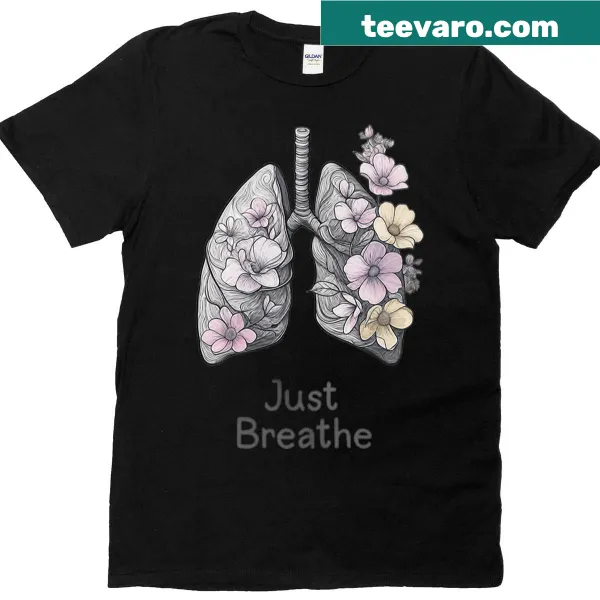 Line-art T-shirt featuring floral lungs and the phrase 'Just Breathe', promoting mental health awareness.