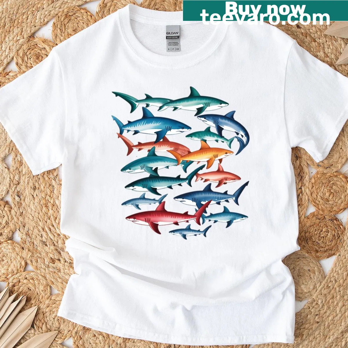 T-shirt featuring an illustration of Great White and Hammerhead sharks at sunset — on a men's t-shirt