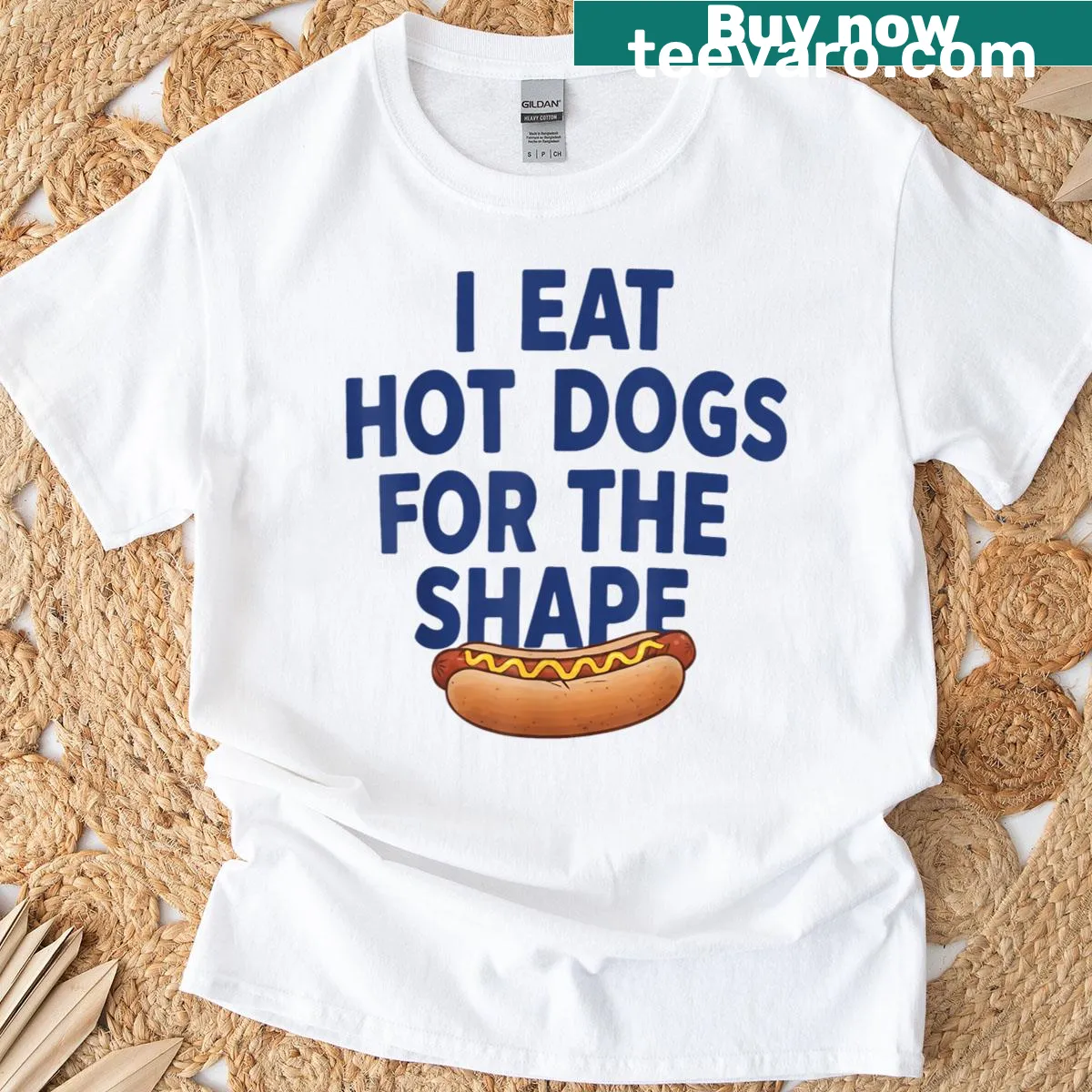 Humorous T-shirt with the text about eating hot dogs for their shape — on a men's t-shirt