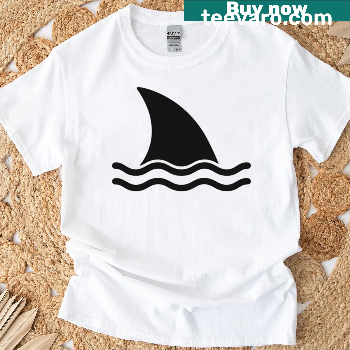 Minimalist shark fin graphic T-shirt referencing Jaws movie — on a men's t-shirt