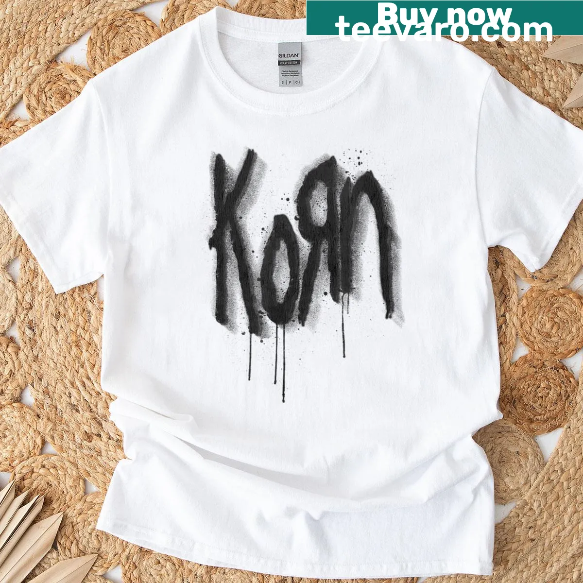 Distressed Korn logo in spray paint design on a T-shirt — on a men's t-shirt