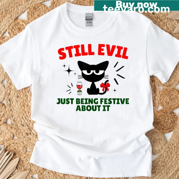 Funny cat t-shirt with festive design and cheeky text.