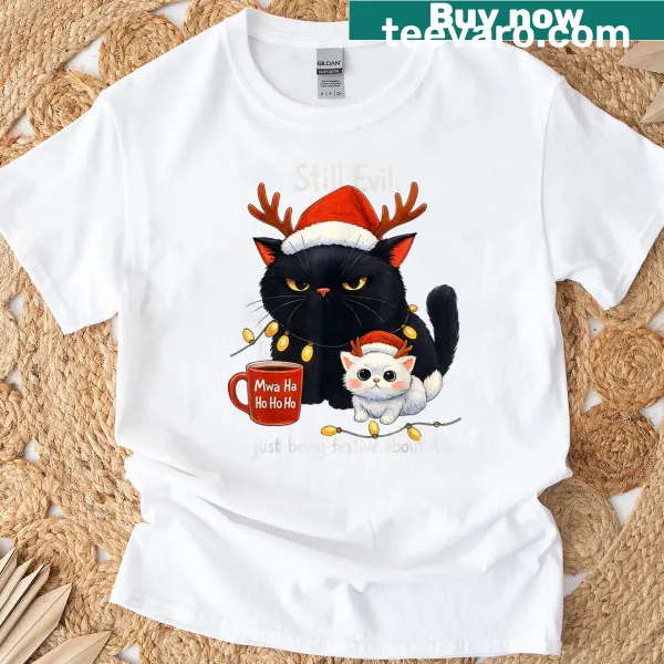 Funny cat Christmas t-shirt with moody cat graphic and festive text.