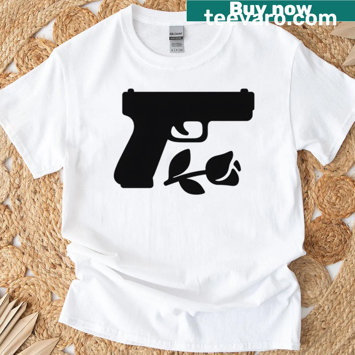 Minimalist T-shirt featuring a rose and pistol graphic — on a men's t-shirt