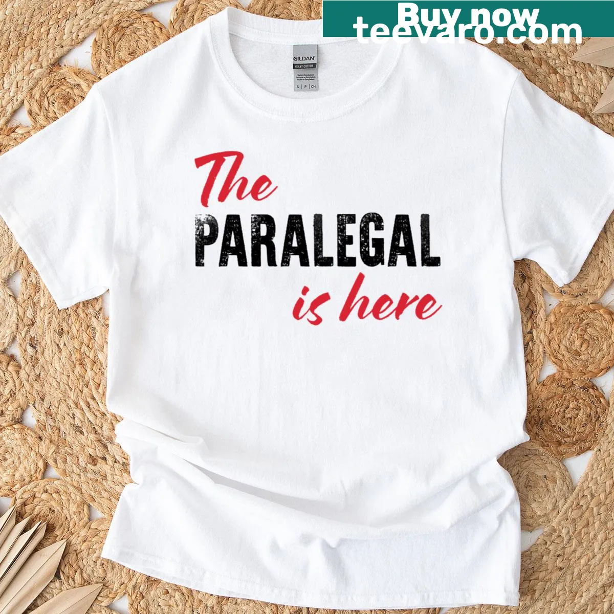 Funny t-shirt declaring 'The Paralegal Is Here' with playful typography — on a men's t-shirt