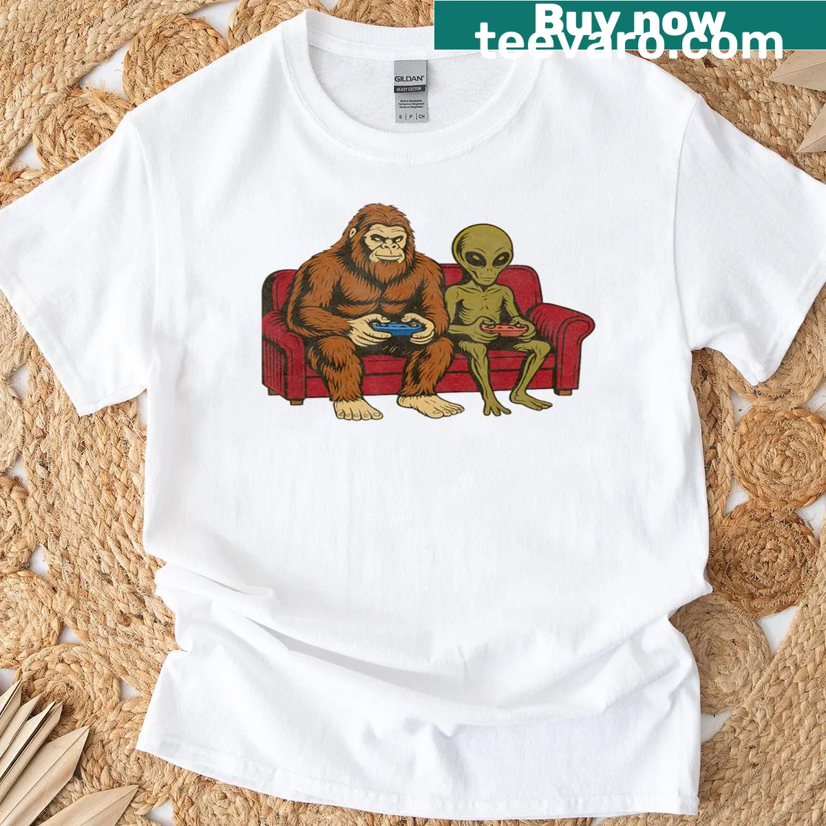 Whimsical T-shirt featuring Bigfoot, aliens, and video game themes — on a men's t-shirt