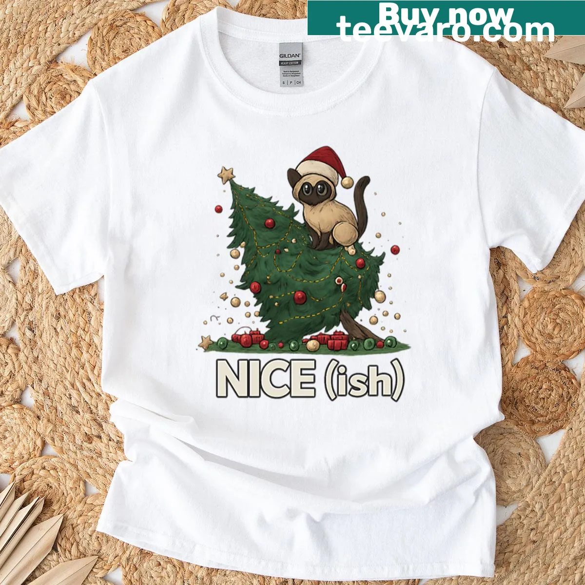 Cartoon cat causing chaos around Christmas tree on t-shirt — on a men's t-shirt