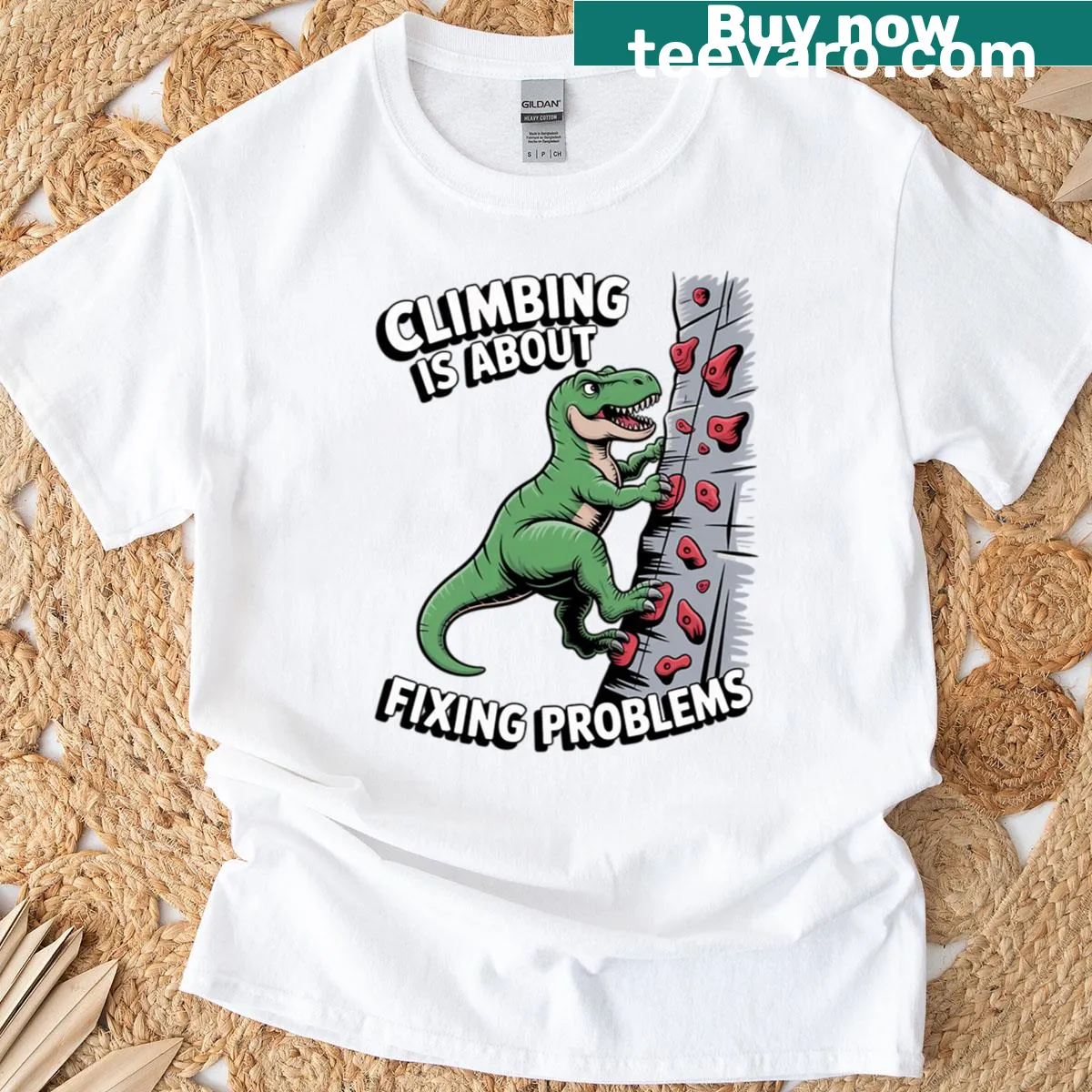 Fun T-rex rock climber dinosaur t-shirt design — on a men's t-shirt