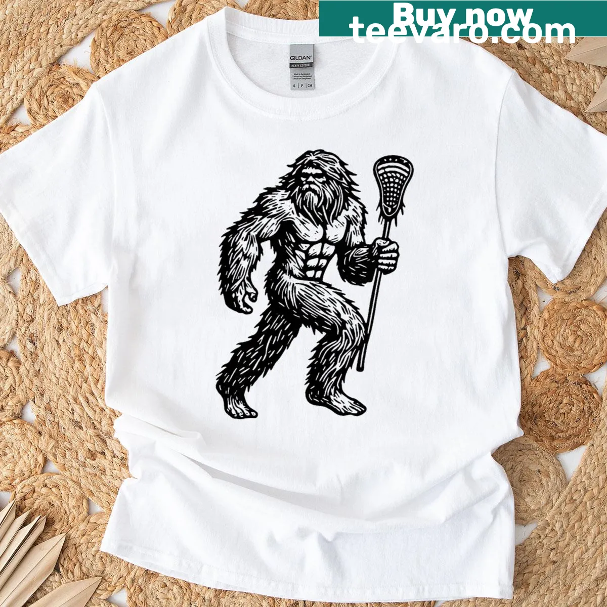 Cartoon Sasquatch playing lacrosse with funny text — on a men's t-shirt