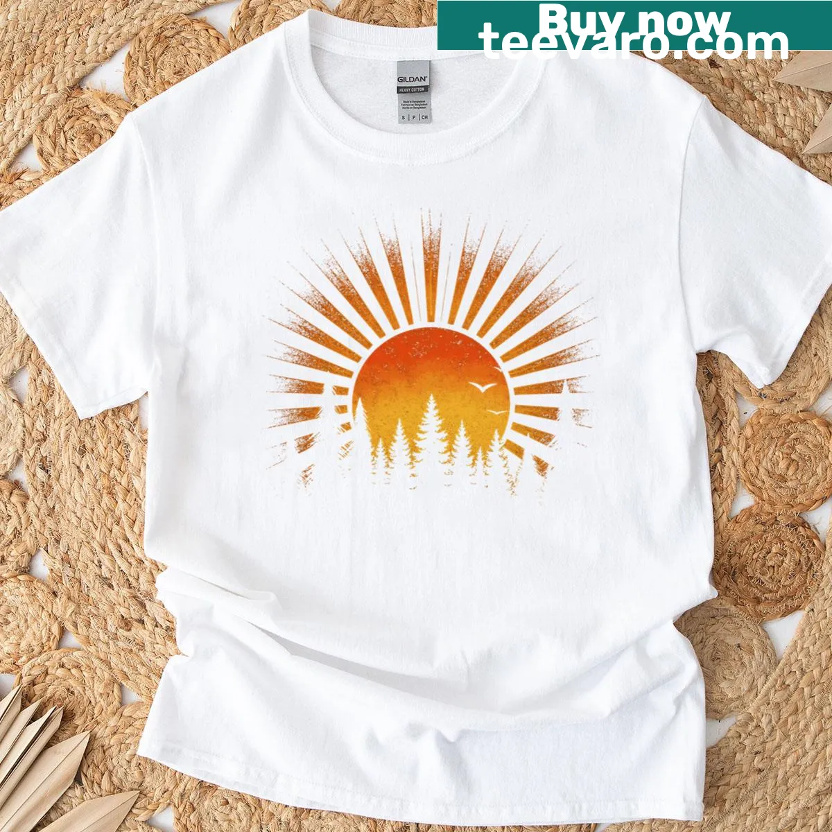 Illustrated forest and sunset graphic on a nature-themed T-shirt — on a men's t-shirt