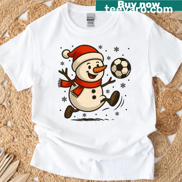 Christmas T-shirt featuring a snowman playing soccer in a playful design
