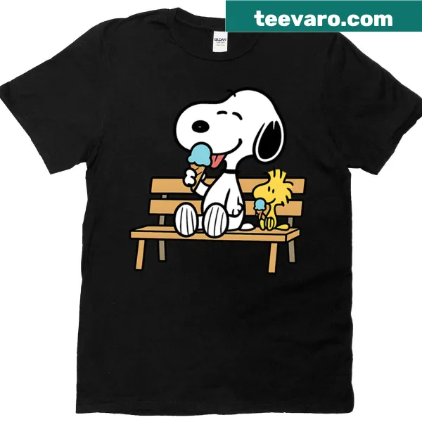 Snoopy and Woodstock on a bench in a Peanuts design T-shirt