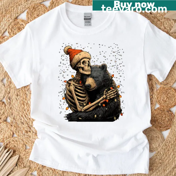 Skeleton hugging a bear wearing a Santa hat in a snowy scene