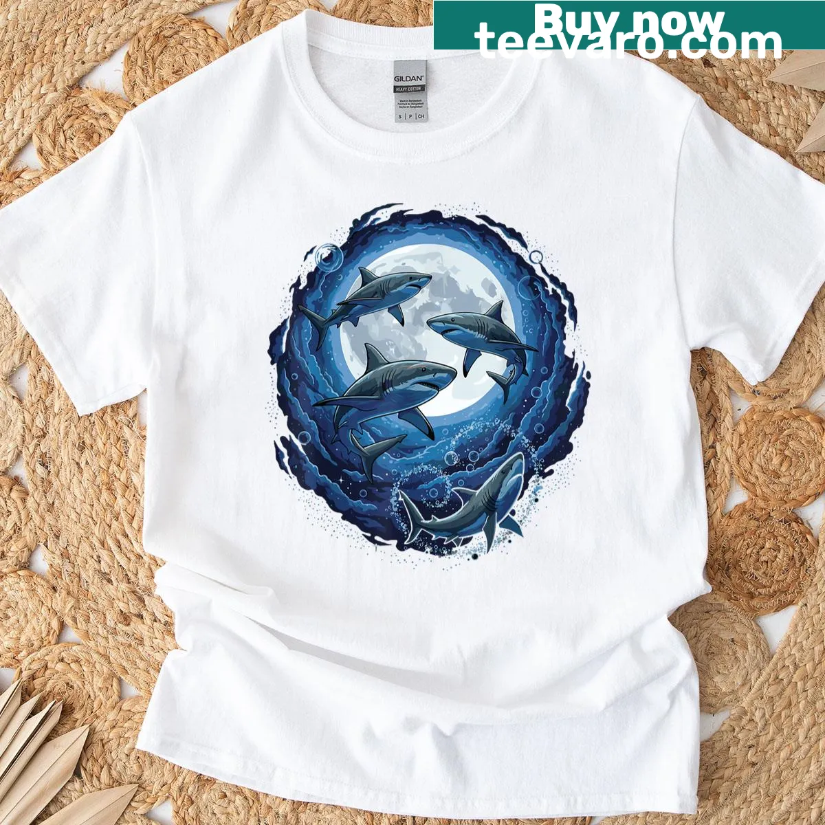 Playful graphic t-shirt depicting sharks in space with three moons, blending ocean and cosmic themes — on a men's t-shirt