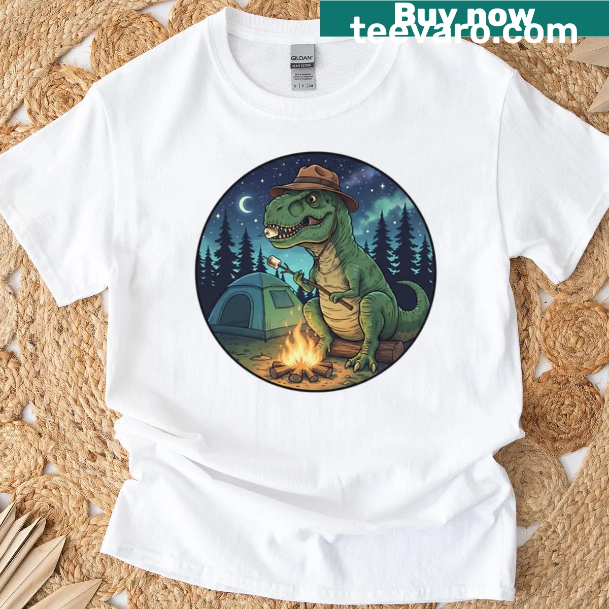 Playful T-rex roasting marshmallows camping graphic t-shirt — on a men's t-shirt