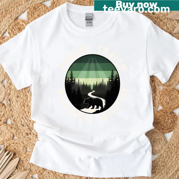 Illustrative graphic of forest trails with trees and mountains on a t-shirt.