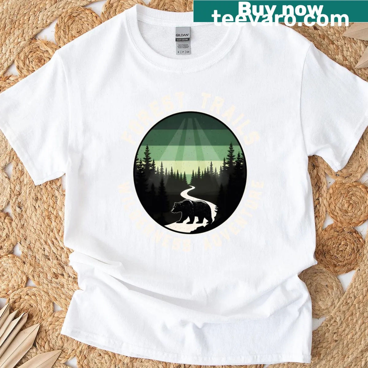 Illustrative graphic of forest trails with trees and mountains on a t-shirt. — on a men's t-shirt