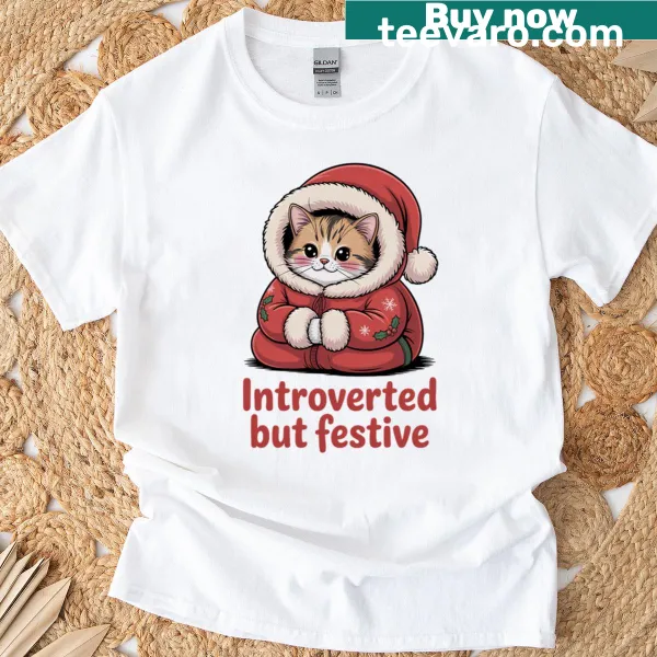 Cartoon graphic of a festive cat on a Christmas t-shirt.