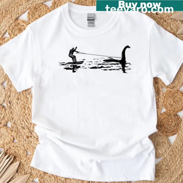 Whimsical T-shirt featuring Bigfoot waterskiing behind Nessie