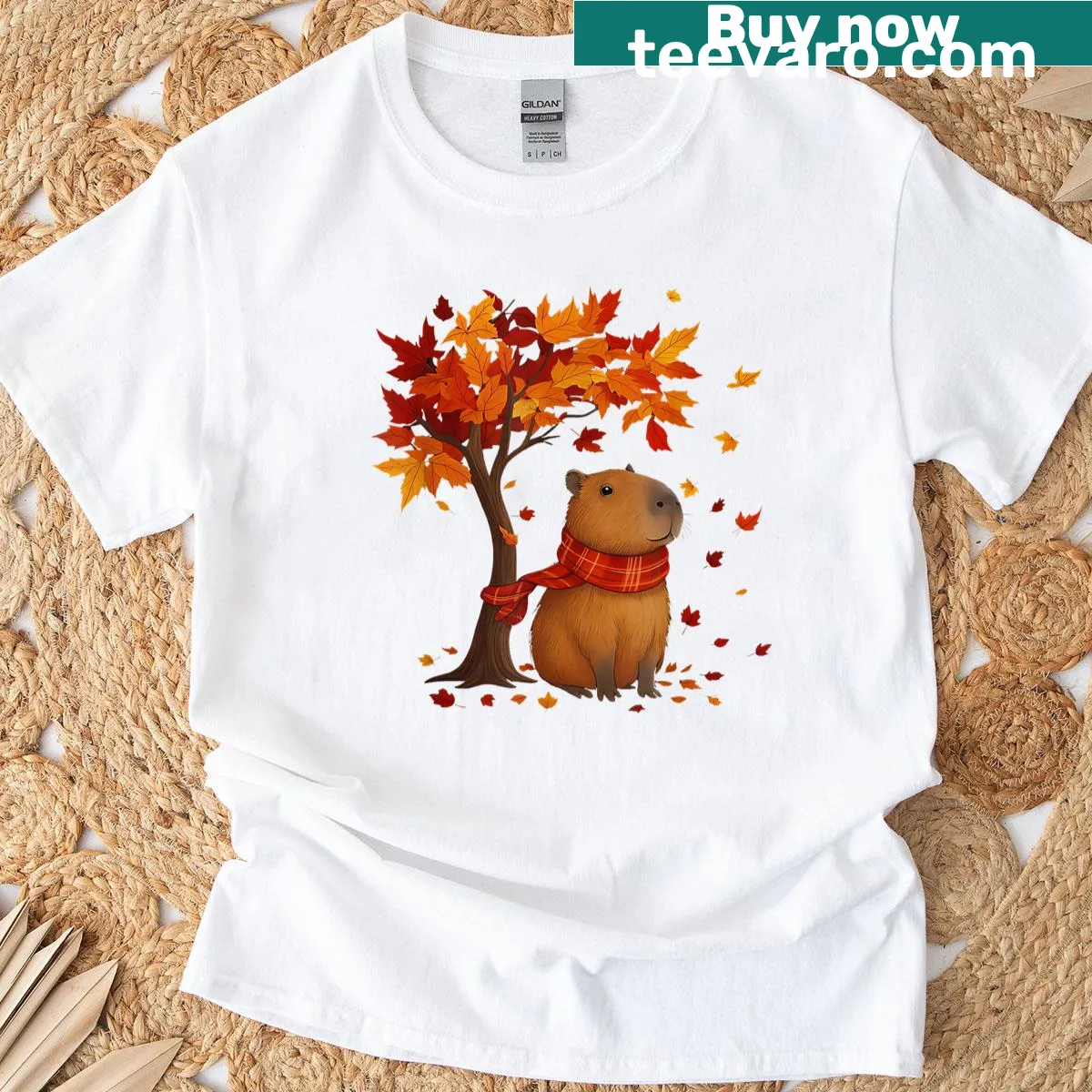 Illustration of a capybara among autumn leaves on T-shirt — on a men's t-shirt