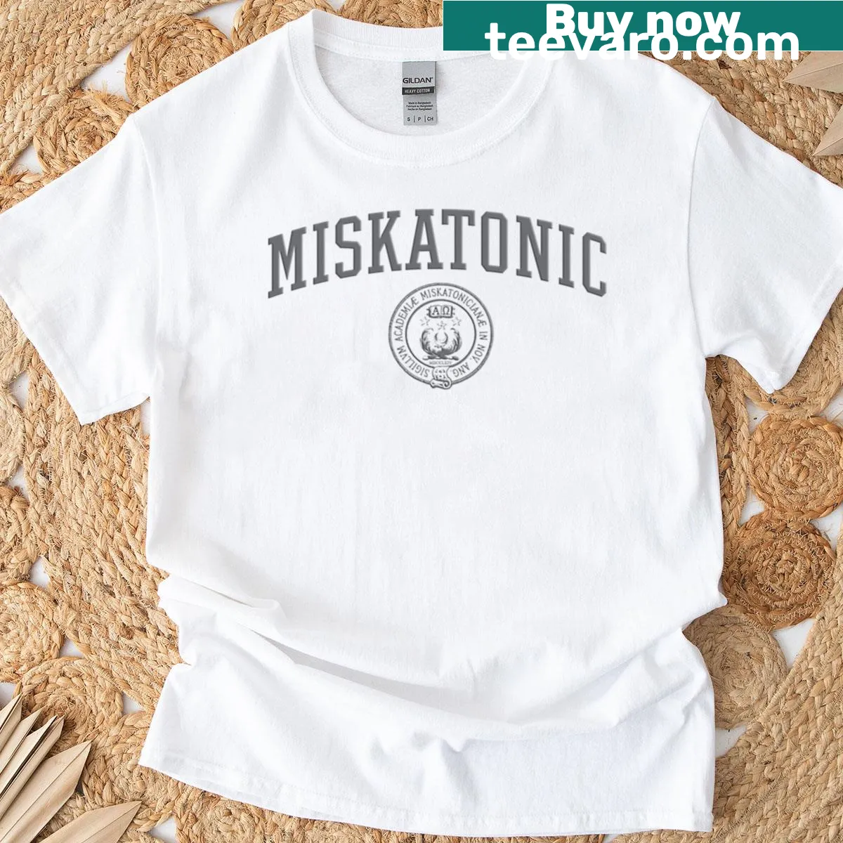 Collegiate T-shirt featuring 'Miskatonic University' in a badge design — on a men's t-shirt