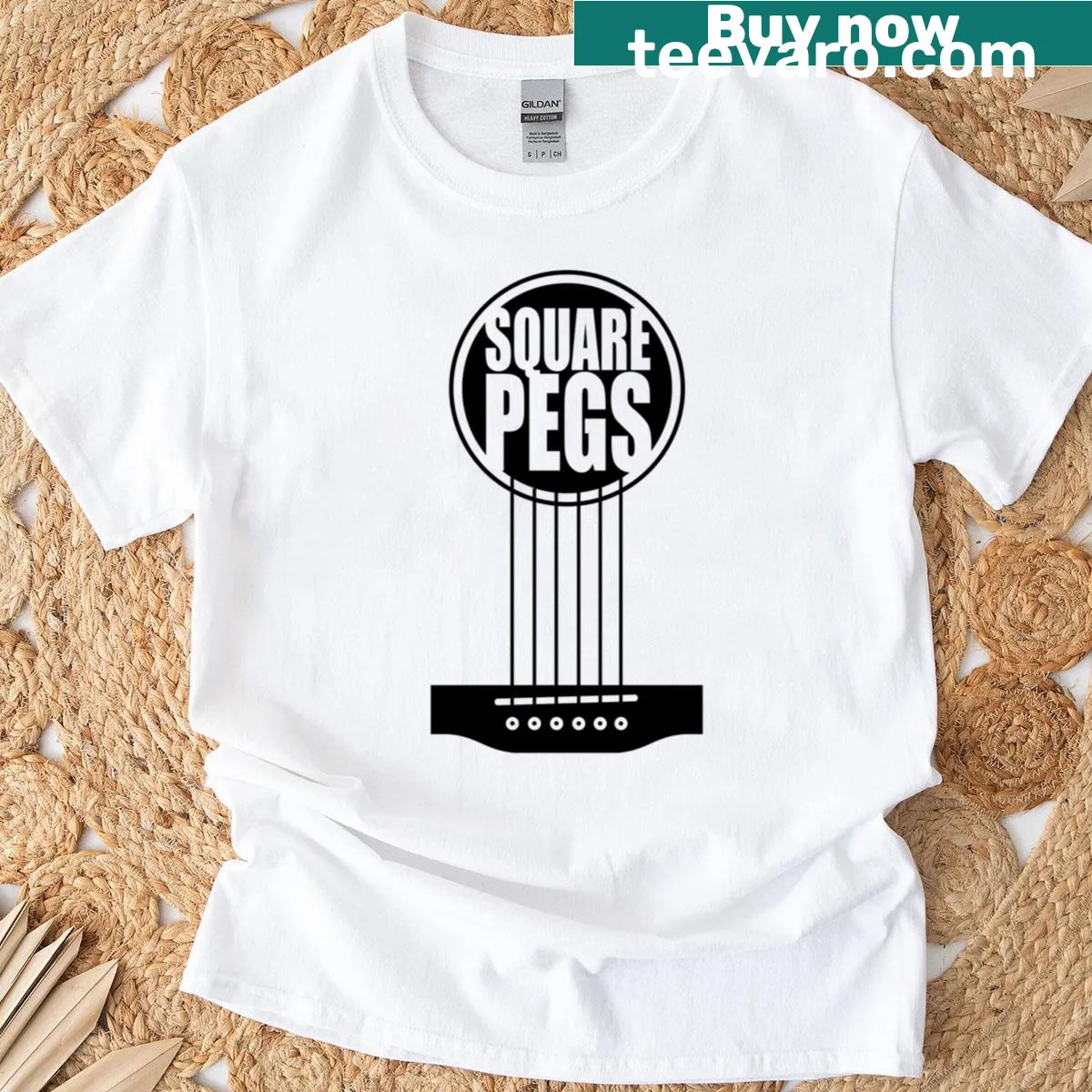 Acoustic guitar logo graphic on a music-themed t-shirt — on a men's t-shirt