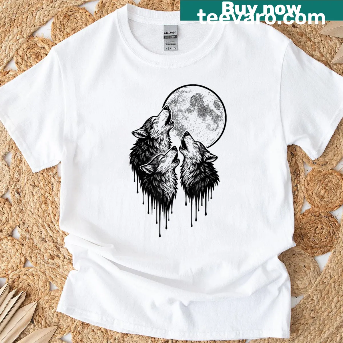 T-shirt depicting a wolf howling at the moon in a natural setting. — on a men's t-shirt
