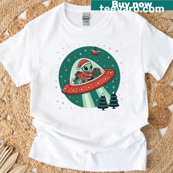 Cute alien Santa and UFO graphic on an oversized Christmas T-shirt.