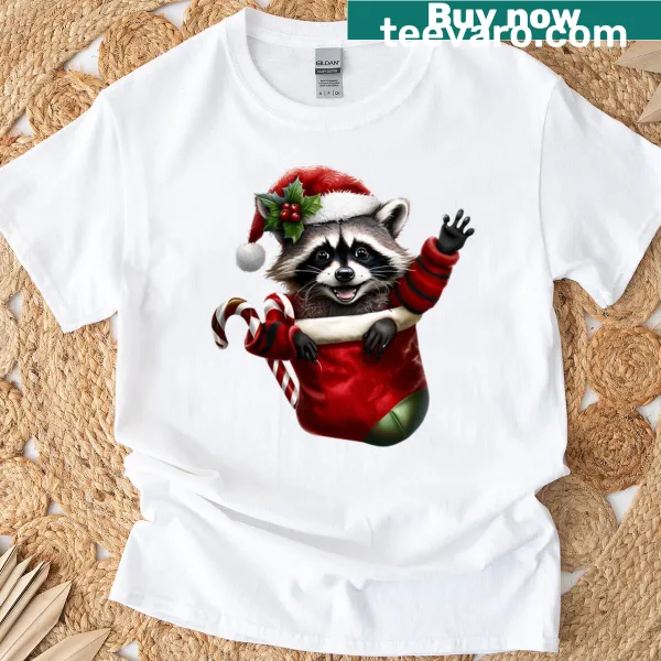 Playful Christmas raccoon graphic on a t-shirt