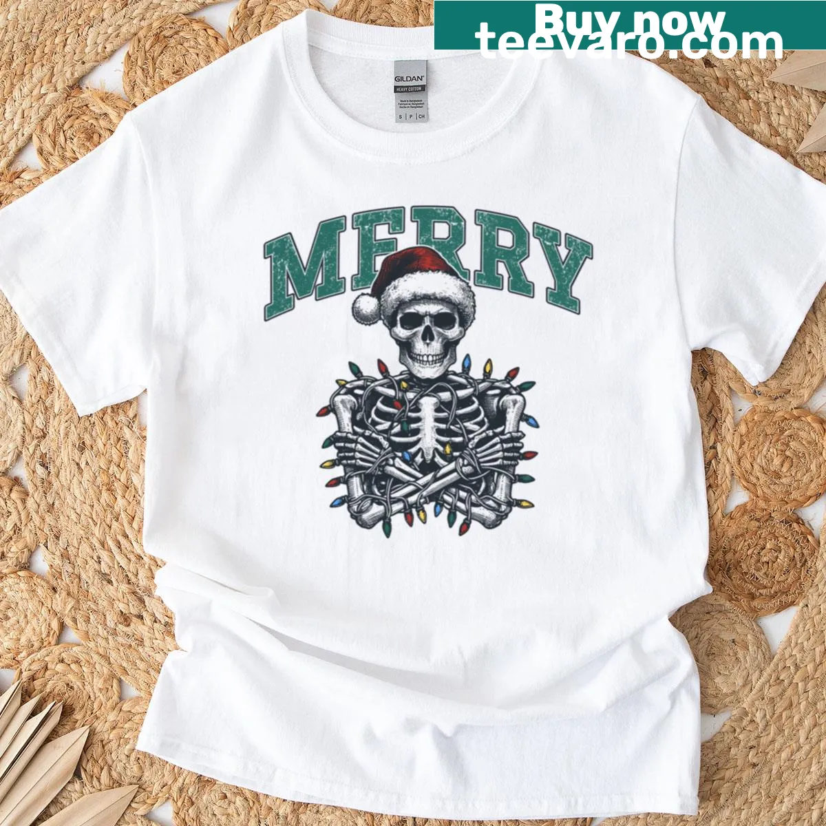 Skeleton in holiday attire featured on a Christmas-themed shirt. — on a men's t-shirt
