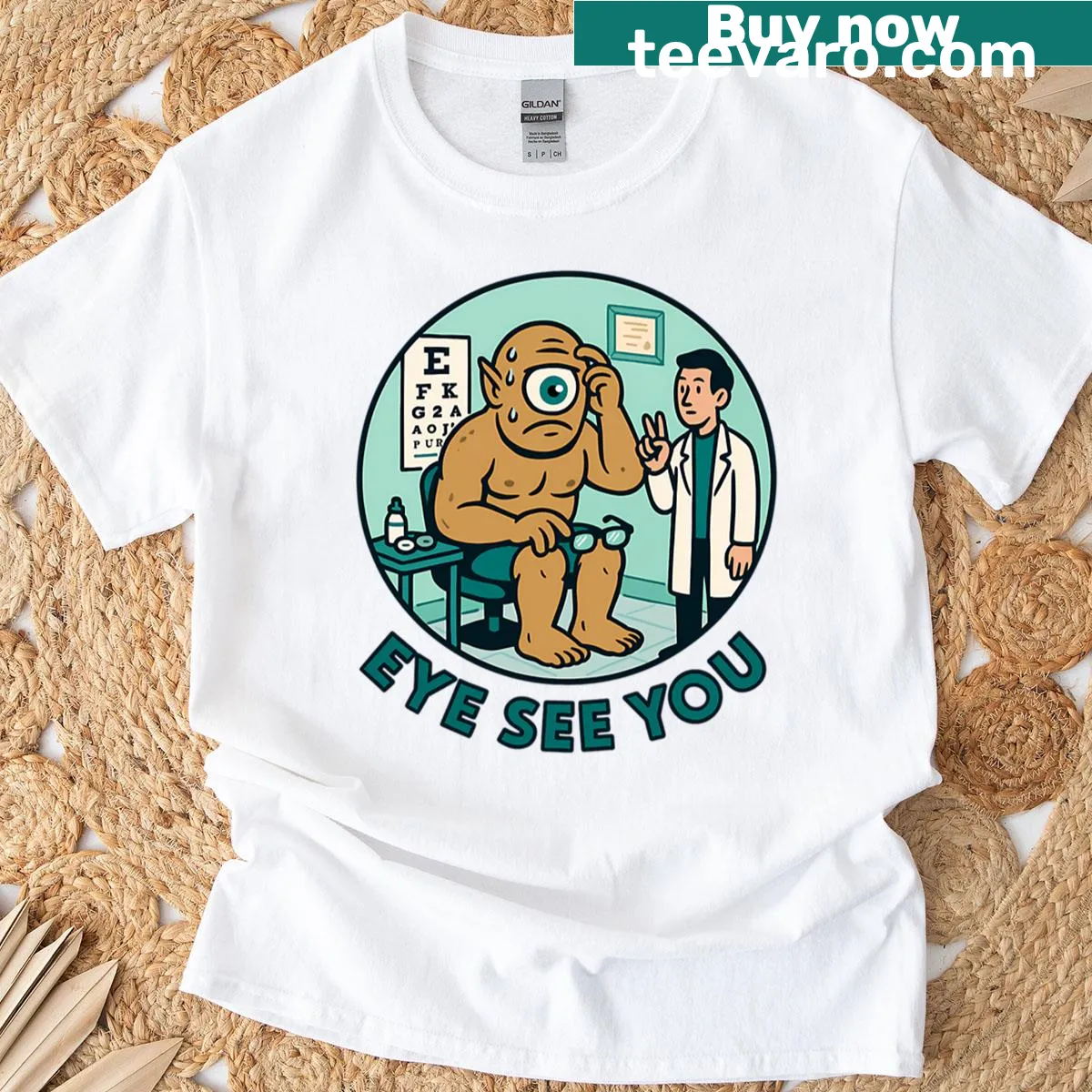 Humorous T-shirt featuring a cyclops eye exam design. — on a men's t-shirt