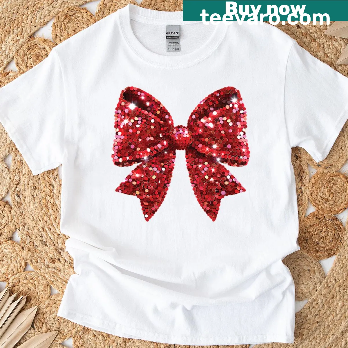 Boxy t-shirt featuring a glittery bow design for Christmas — on a men's t-shirt