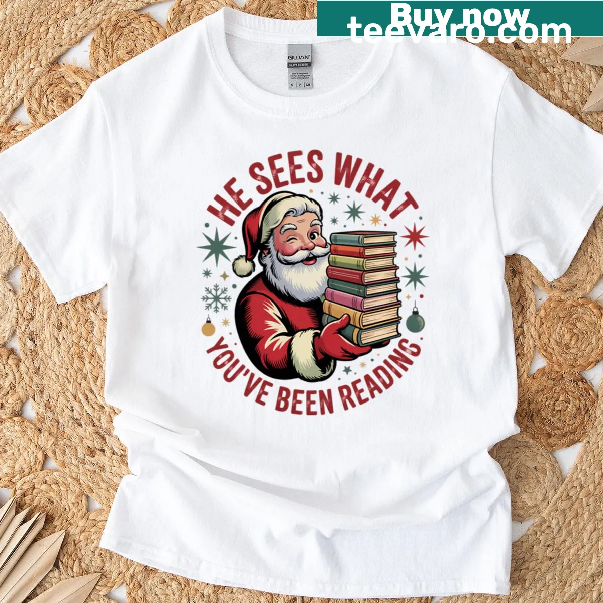 Playful Santa reading-themed t-shirt with whimsical graphics — on a men's t-shirt