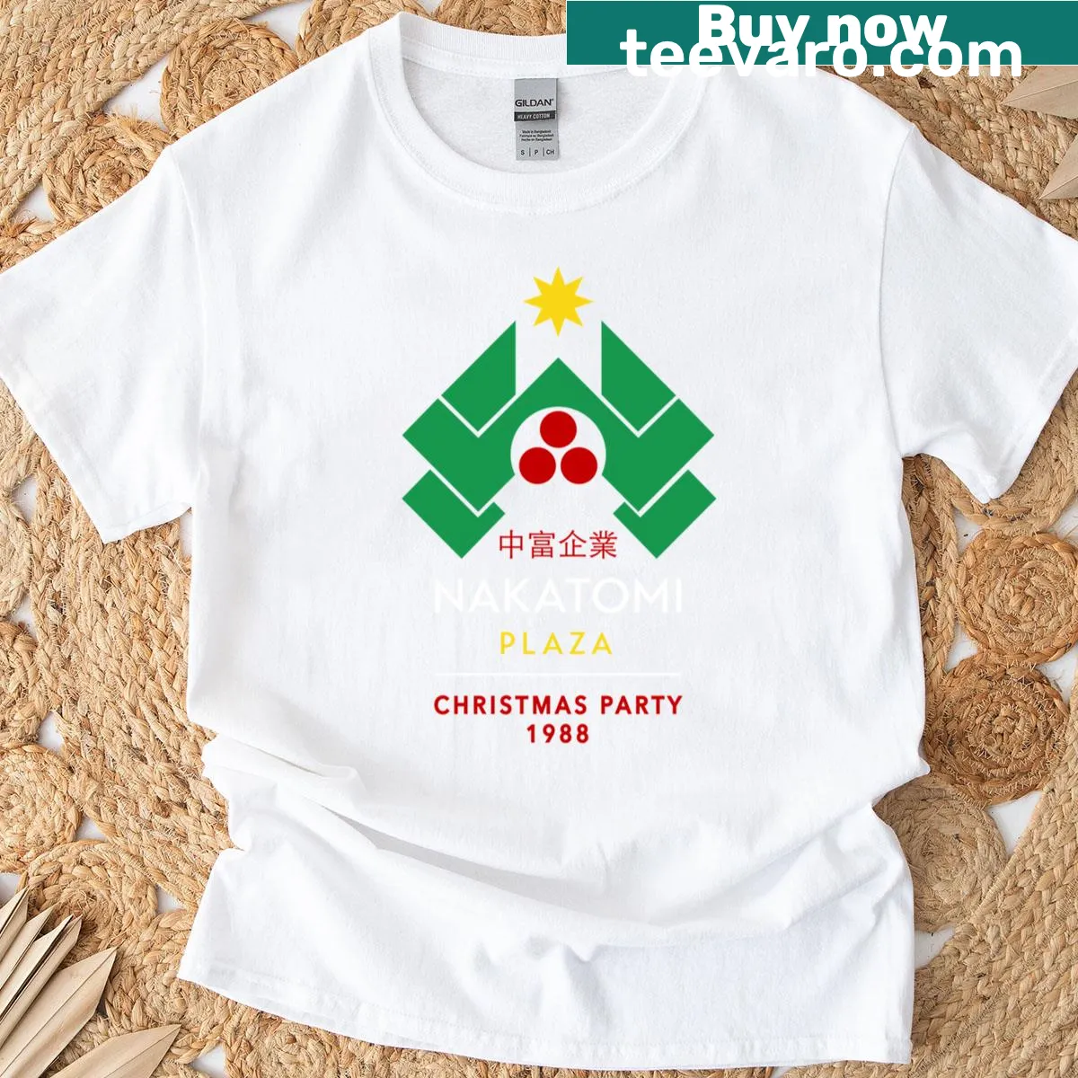 Vintage Nakatomi Plaza Christmas Party t-shirt with bold lettering — on a men's t-shirt