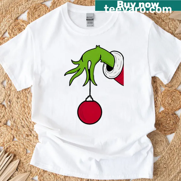 T-shirt featuring a playful illustration of the Grinch