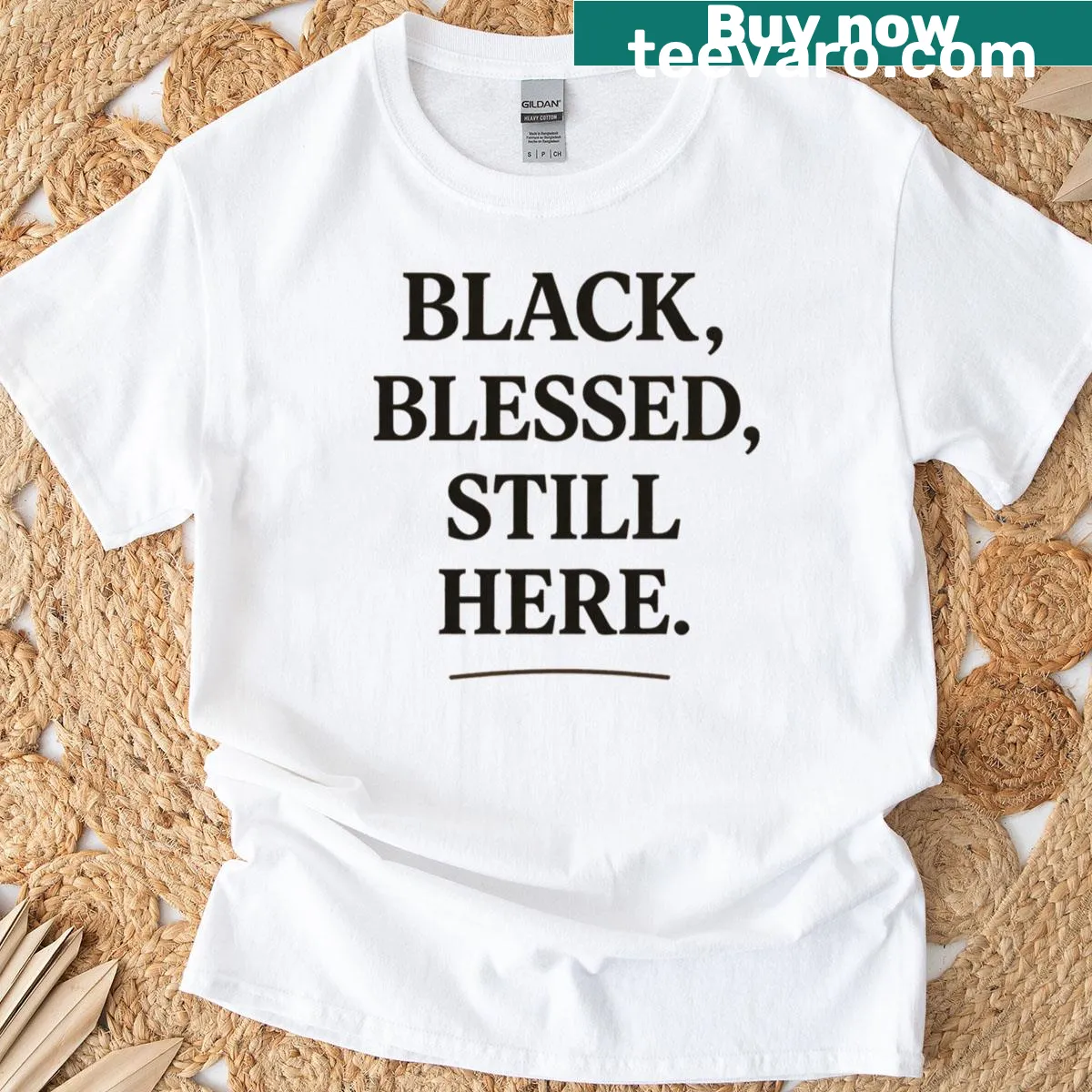Typography T-shirt with the phrase 'Black Blessed Still Here' — on a men's t-shirt