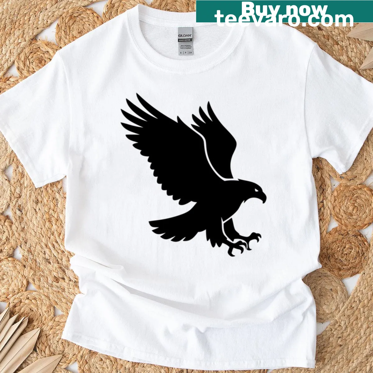 Minimalist T-shirt featuring a flying eagle silhouette in black — on a men's t-shirt