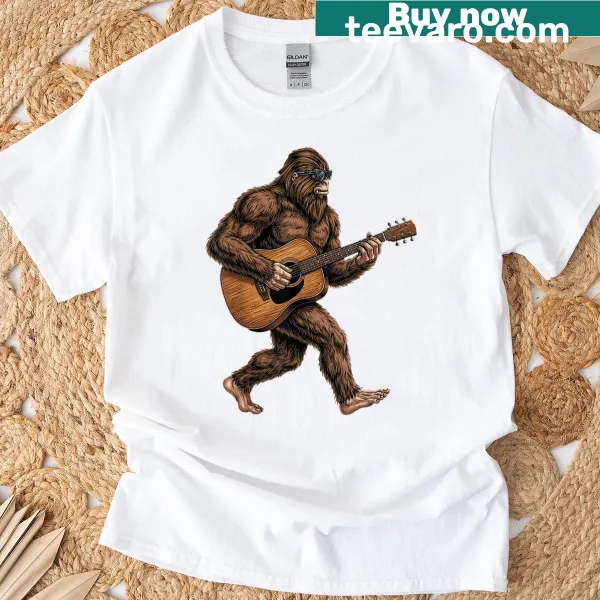 Funny t-shirt with Bigfoot playing guitar illustration