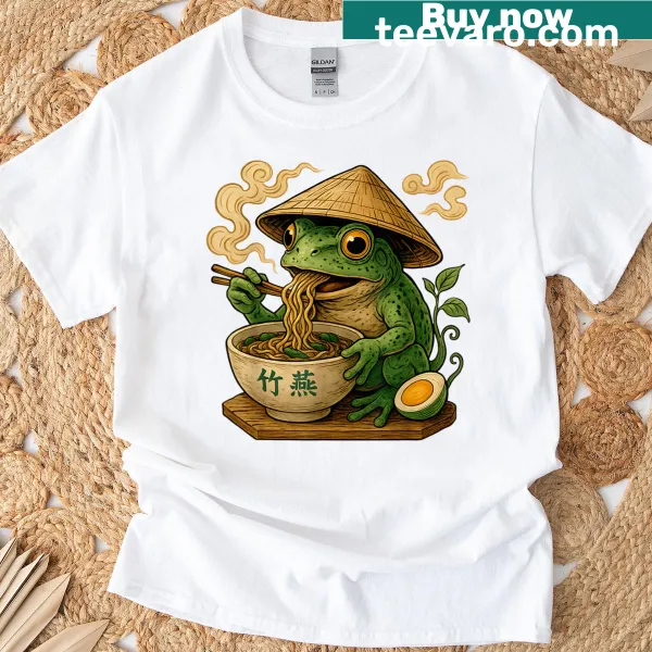 Kawaii frog graphic enjoying ramen noodles in a cheerful style