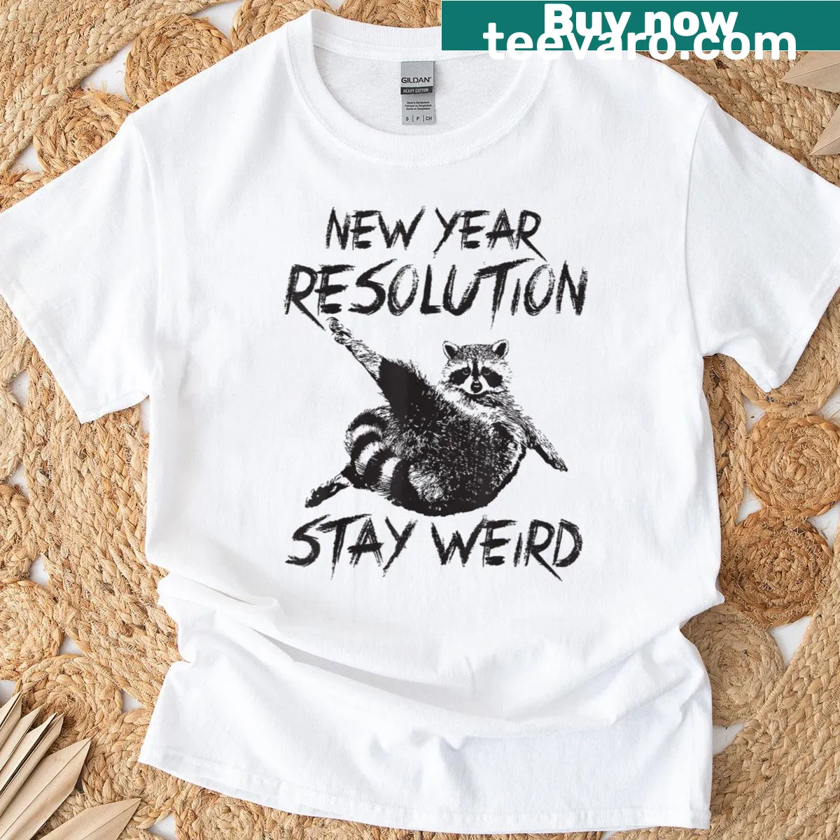 Raccoon graphic with 'Stay Weird' quote on t-shirt — on a men's t-shirt