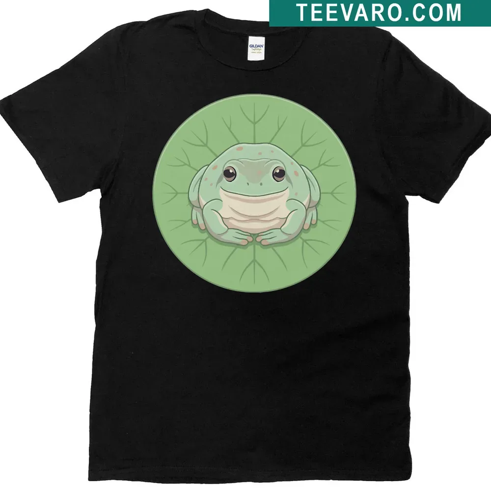 Cartoon dumpy tree frog on lily pad, surrounded by greenery. — on a men's t-shirt