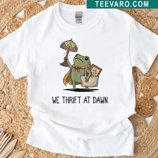 Vintage distressed shirt with a frog graphic and 'We Thrift At Dawn' text