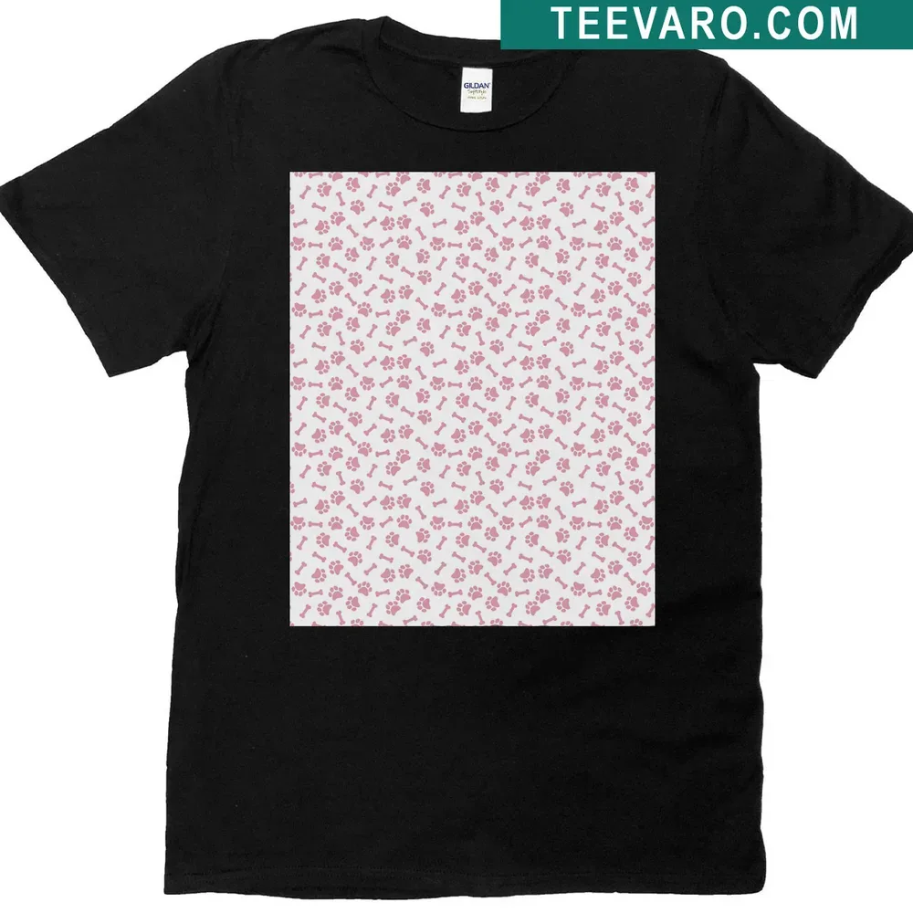Illustrated shirt featuring a pattern of dog paws and bones in pink. — on a men's t-shirt